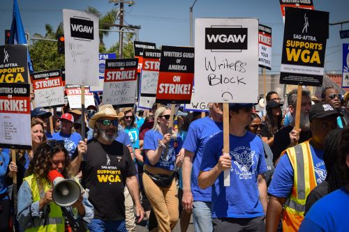 Members of the Writers Guild of America on the picket line in Los Angeles, the United States on June 21.