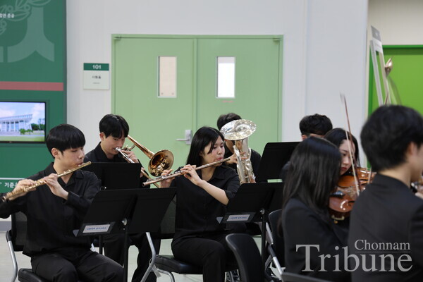 The ochestra, composed of the Music Education department students, performs commemorative songs on April 16.