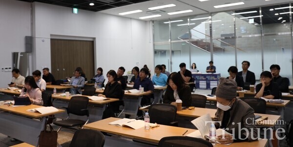 Attendees listen to her presentation on affection.