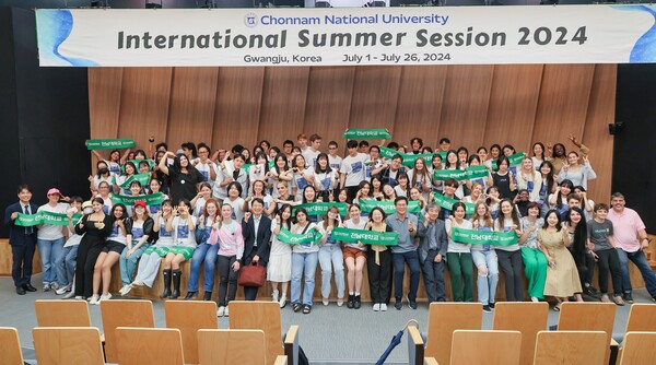 Students, professors, and staff members pose after the farewell ceremony of the 2024 CNU ISS 2024 at Cosmos Hall on July 26.