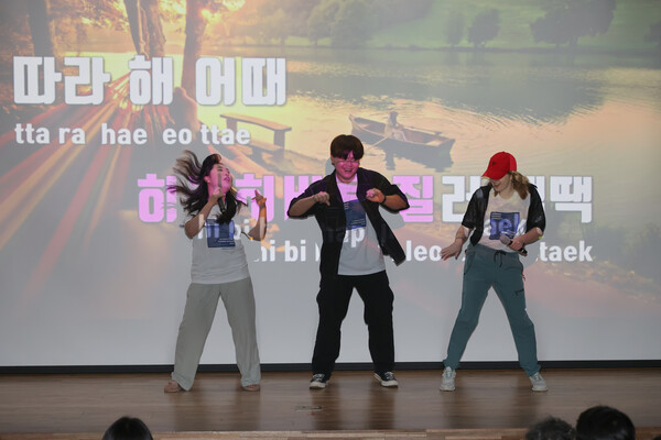 Students dancing on the stage at the farewell ceremony on July 26