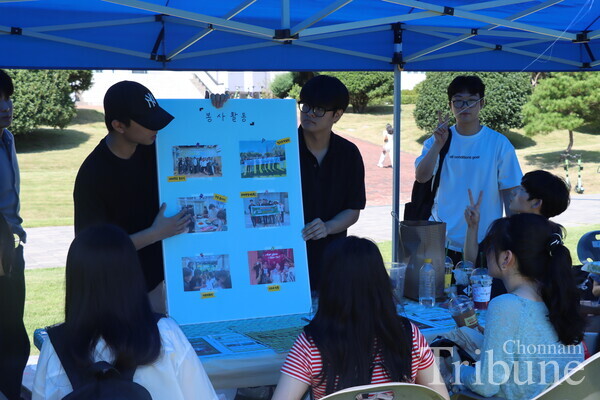 A club member is delivering an introduction about his club's annual activities and projects.