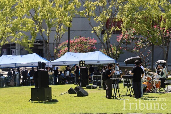 The music band is getting prepared for its energetic performances taking place at night.
