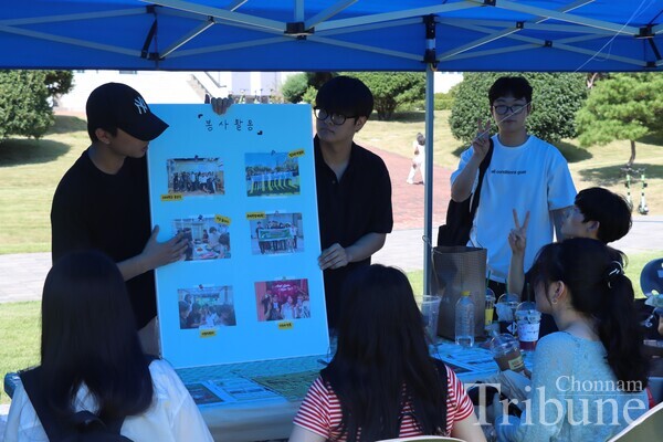 A club member is delivering an introduction about his club's annual activities and projects.