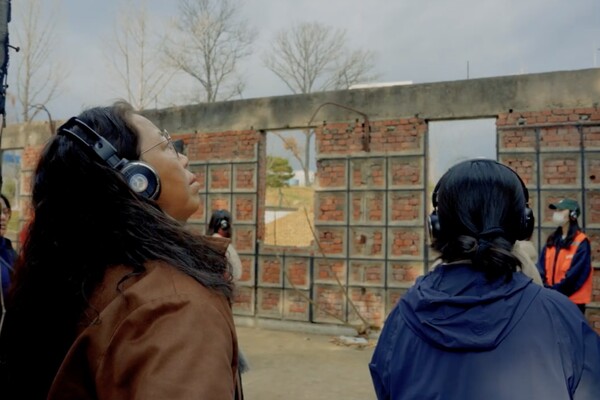 Participants listen to recorded audio tapes during a showcase of “Concrete Voice 2: 505 Security Force.