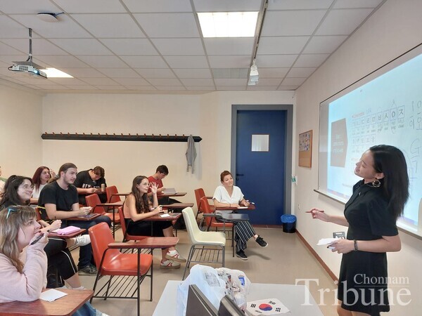 Raon Park during her Hangul Day culture seminar teaching students how to write Hangul