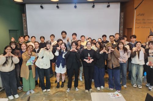 Participants pose for a picture during the “Hello, CNU!” exchange meeting.