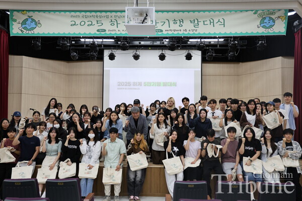 Participants of the ceremony pose for a picture.