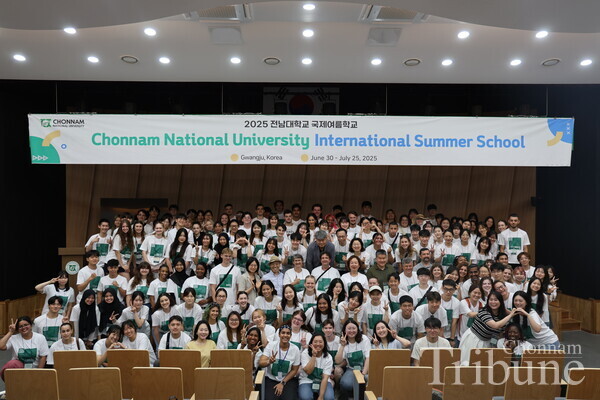Orientation participants gather for a group photo after the session.