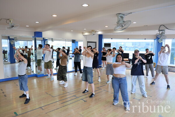 Students dance to "Candy" by NCT, a popular Korean boy band.