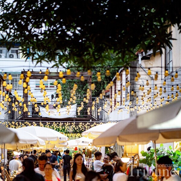 Visitors roaming the streets of Shenji New Village in Taichung, Taiwan